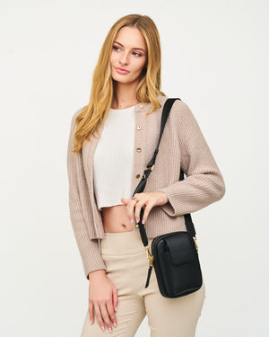The Kristen Crossbody Genuine Leather Black Bag with Cross Body Nylon Adjustable Shoulder Strap, Phone pocket made to fit all and any iPhone Size with case on with magnetic snap shut closure, main compartment with secure zipper closure and roomy compartment made to fit all essentials, back passport sleeve, and interior compartment. Perfect for any occasion, travel / airport, and everyday wear.